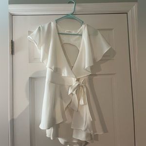 White romper perfect for beach vacation, graduation, conformation, and much more